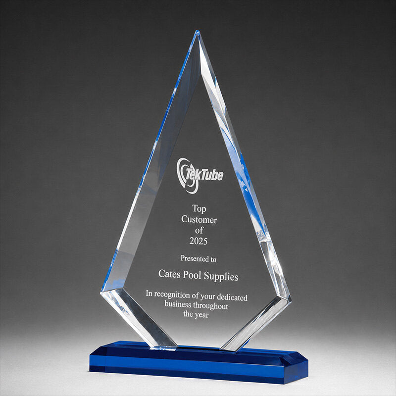 Clear acrylic diamond award on a blue base